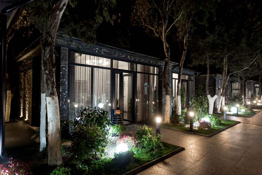 Modern residential property with outdoor lighting at night