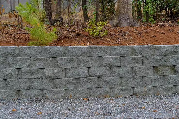 retaining walls with landscaped planting beds on a sloped property